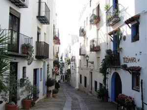 lovely-narrow-street-and-balconies-decorated-with-plants-in-peniscola-spain-john-a-shiron Medium